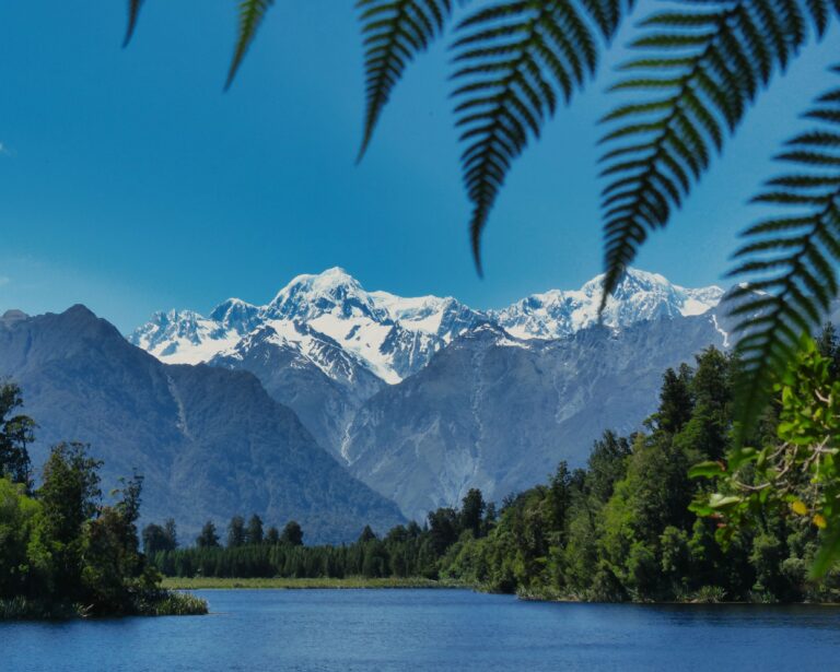 Sleeping in a DOC Campsite Carpark to Watch the Dawn Over Lake Matheson Without Another Soul in Sight